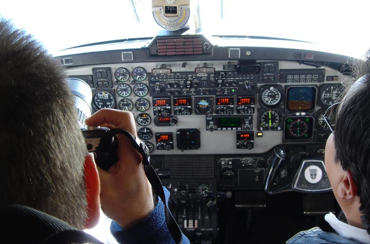 Phil (left) gets to sit next to the pilot!