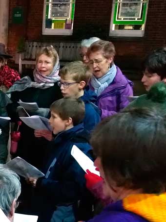 iz takes part in carol singing around Petersfield