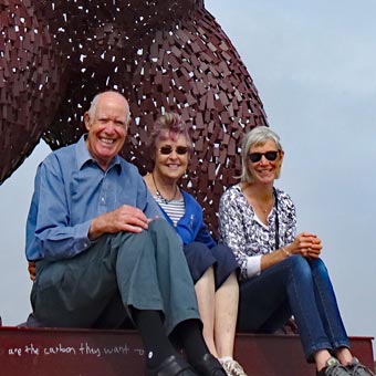 At the feet of a ginormouse bear!