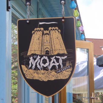 The Moat and Castle" - pub in Graham and Lesley's Garden. Sign designed by Mark